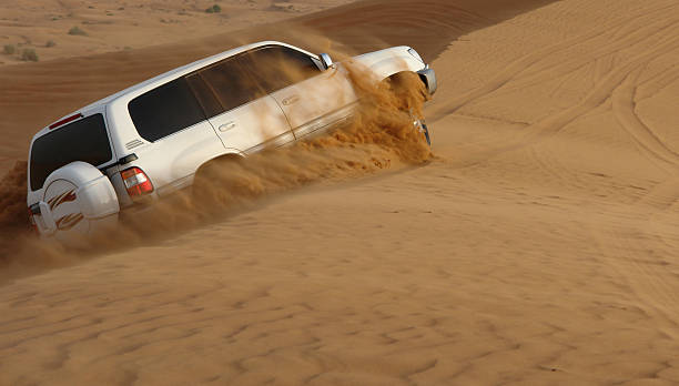 A 4-weel drive car in action in a desert safari trip